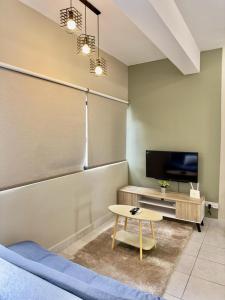 TV a/nebo společenská místnost v ubytování Cozy Homely Studio @ Youth City Residence Nilai