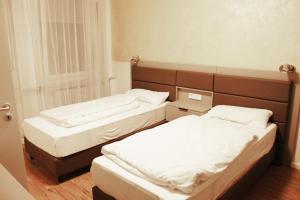 Postel nebo postele na pokoji v ubytování Isar City Hotel