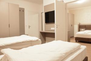 Postel nebo postele na pokoji v ubytování Isar City Hotel