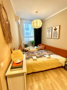 a small bedroom with a bed and a window at Apartment Jenny - Old Town, Free Private Parking, AC in Bratislava