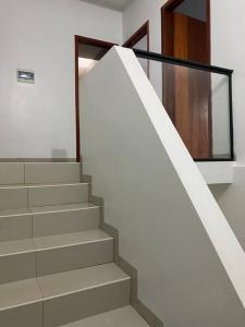 a staircase in a house with a glass door at Apartamento, Salto del Guaira in Salto del Guairá