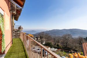 a balcony of a house with a view of the mountains at [Colazza] Appartamento Gelsomino - La Casa dei Sogni in Colazza