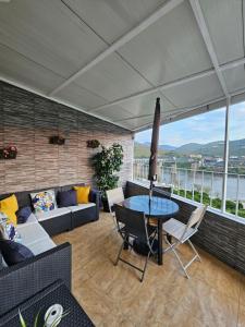 a living room with a couch and a table at Vistadouro in Peso da Régua