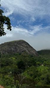 a large mountain in the middle of a field at Pousada paraíso pedra do Rodeadouro in Bonito