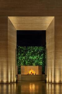 a fireplace in a building with a fire pit at The West Hollywood EDITION in Los Angeles