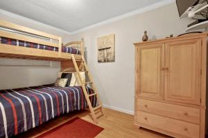 a bedroom with two bunk beds and a cabinet at Myrtle Beach Resort A316 in Myrtle Beach