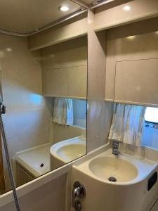 a bathroom with a sink and a mirror at Mythos presso Ristorante Il Gambero Rosso in Porto Ercole