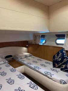 two beds on the back of a boat at Mythos in Porto Ercole