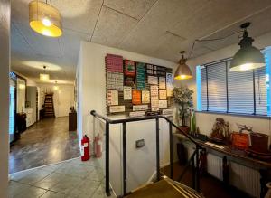 a room with a food counter and some lights at Barneys Rooms in Hundige