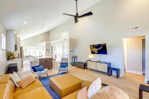 a living room with a couch and a table at Chic Spacious AVL Oasis with Hot Tub and Fire Pit in Asheville