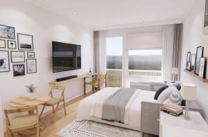 a white bedroom with a bed and a table and a desk at Dexter Suite in Elk Rapids