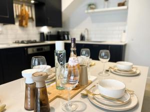 a table with wine glasses and wine bottles on it at Seagrass in Sandown