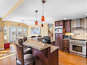 a kitchen with a center island with a counter top at Spectacular 6 Bedroom Home On The Oceanblock In Beach Haven!!! Hot Tub!!! in Beach Haven