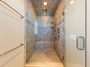 a bathroom with a shower with a glass door at Spectacular 6 Bedroom Home On The Oceanblock In Beach Haven!!! Hot Tub!!! in Beach Haven +32 photos