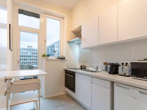Kuchyň nebo kuchyňský kout v ubytování Magnifique appartement - Quartier Louise!