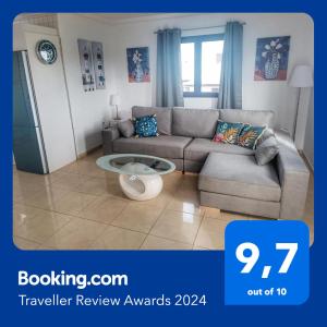 a living room with a couch and a table at CASA CUADERNA a 150 metros de la playa in Playa Honda