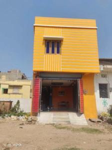 a yellow building with a red door on top of it at GRG M S M Residency Puri in Puri