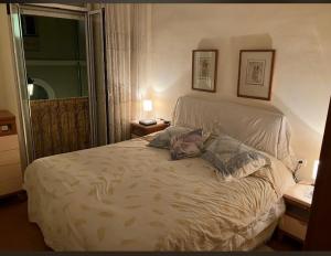 a bedroom with a bed with two pillows on it at Private SINGLE room in RUZAFA, ladies only, non smoker in Valencia