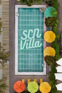 an overhead view of a swimming pool with colorful umbrellas at SCN Resort and Spa Rayong in Ban Chang