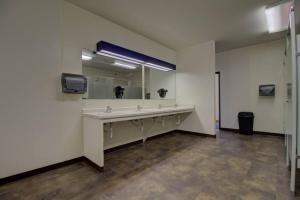 a bathroom with a sink and a large mirror at Escape to a Studio Style Hideaway Nature and Lake in Clitherall