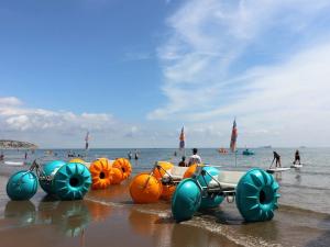 a group of inflatable cars on the beach at The Beach Retreat - Pet Friendly in Sandown