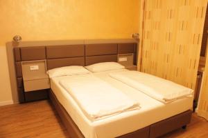 Postel nebo postele na pokoji v ubytování Isar City Hotel