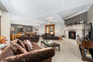 a living room with a couch and a fireplace at Property 434 - Oughterard in Oughterard