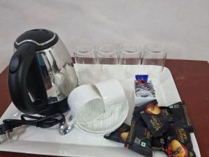 Příslušenství pro přípravu čaje a kávy v ubytování The Red Soil Country