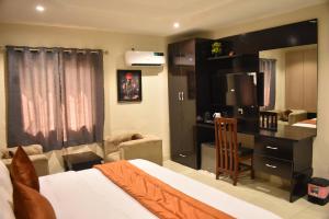 Postel nebo postele na pokoji v ubytování Ifycious Lodge + 5 fotografií