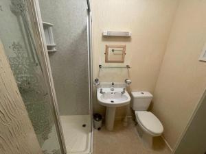 a small bathroom with a toilet and a sink at THE WILFORD HOTEL in Blackpool