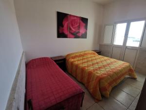 Ένα ή περισσότερα κρεβάτια σε δωμάτιο στο Capu Cilona