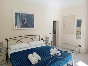 Posteľ alebo postele v izbe v ubytovaní Palazzo Castellano