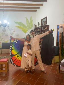 a man and a woman and a child posing for a picture at Casa Paula santa marta in Gaira