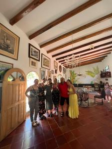 a group of people standing in a room at Casa Paula santa marta in Gaira