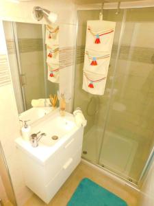 a bathroom with a sink and a shower with towels at Vita in Bribir +22 photos