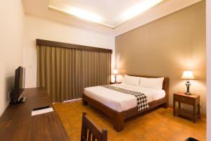 TV a/nebo společenská místnost v ubytování Vidi Boutique Hotel