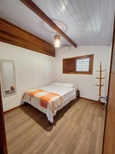 Ein Bett oder Betten in einem Zimmer der Unterkunft camarote da pipa