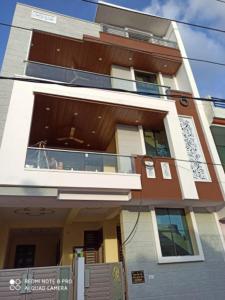 an apartment building with a balcony and a balcony at Adinath Residency in Jaipur
