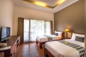 Postel nebo postele na pokoji v ubytování Vidi Boutique Hotel