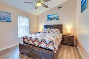 a bedroom with a bed and a ceiling fan at Pet-Friendly Fort Pierce Home with Deck and Pool! in Fort Pierce