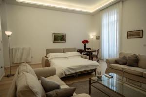 a living room with a bed and a couch at Luxury apartment in Naples in Naples