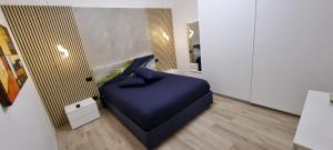 Un pat sau paturi într-o cameră la BARION