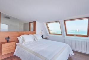 Posteľ alebo postele v izbe v ubytovaní Zen Beach