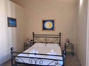 Posteľ alebo postele v izbe v ubytovaní Palazzo Castellano