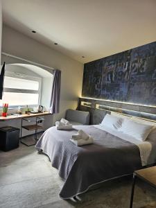 Postel nebo postele na pokoji v ubytování Binario1 Rooms