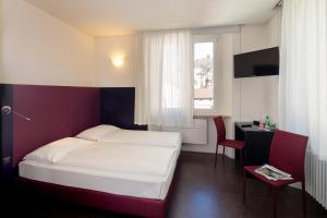 Ένα ή περισσότερα κρεβάτια σε δωμάτιο στο Hotel Rio Muralto