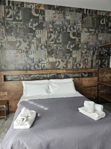 Postel nebo postele na pokoji v ubytování Binario1 Rooms