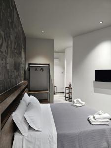 Postel nebo postele na pokoji v ubytování Binario1 Rooms