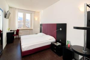 Ένα ή περισσότερα κρεβάτια σε δωμάτιο στο Hotel Rio Muralto