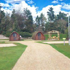 two domes and a playground in a park at Luxe Glamping In A Tiny Home, Adults Only, Dogs Allowed in Lincolnshire